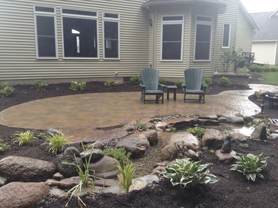 Liver shaped patio design & installation in Rochester New York (NY) by Acorn Ponds & Waterfalls.
