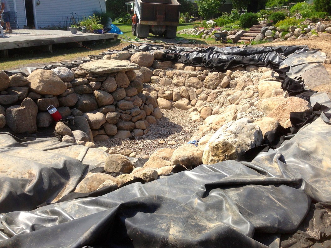 Pond Rock & Boulder Installation In Rochester NY By Acorn Ponds & Waterfalls Call 585-442-6373