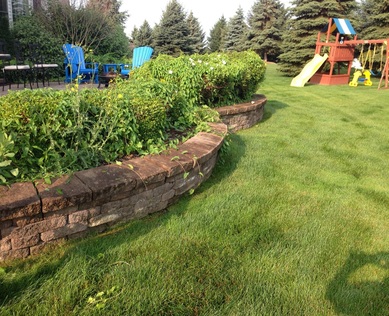 Retaining Wall Repair & Renovation In Rochester, Monroe County (NY) By Acorn Ponds & Waterfalls. Have a professional install your retaining wall and get the job done right... The First Time! Image