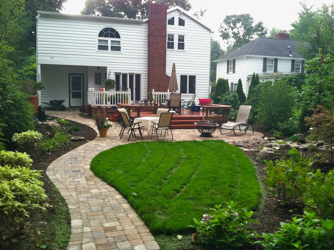 landscaping ideas in Rochester NY, Outdoor Living Area, water feature, patio renovation, landscape lighting and landscape design in Rochester, Monroe County NY By Acorn Ponds & Waterfalls. Image