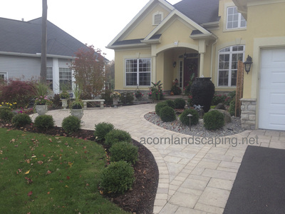 Techo-Bloc paver patio installed in Rochester New York by Acorn Ponds & Waterfalls
