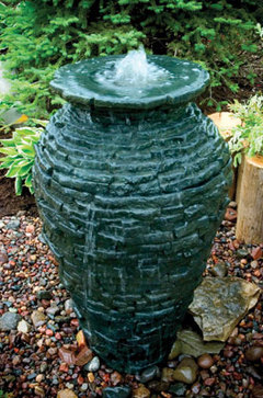 Stacked slate stone urn fountains are a great for decorating your Rochester New York (NY) garden space.