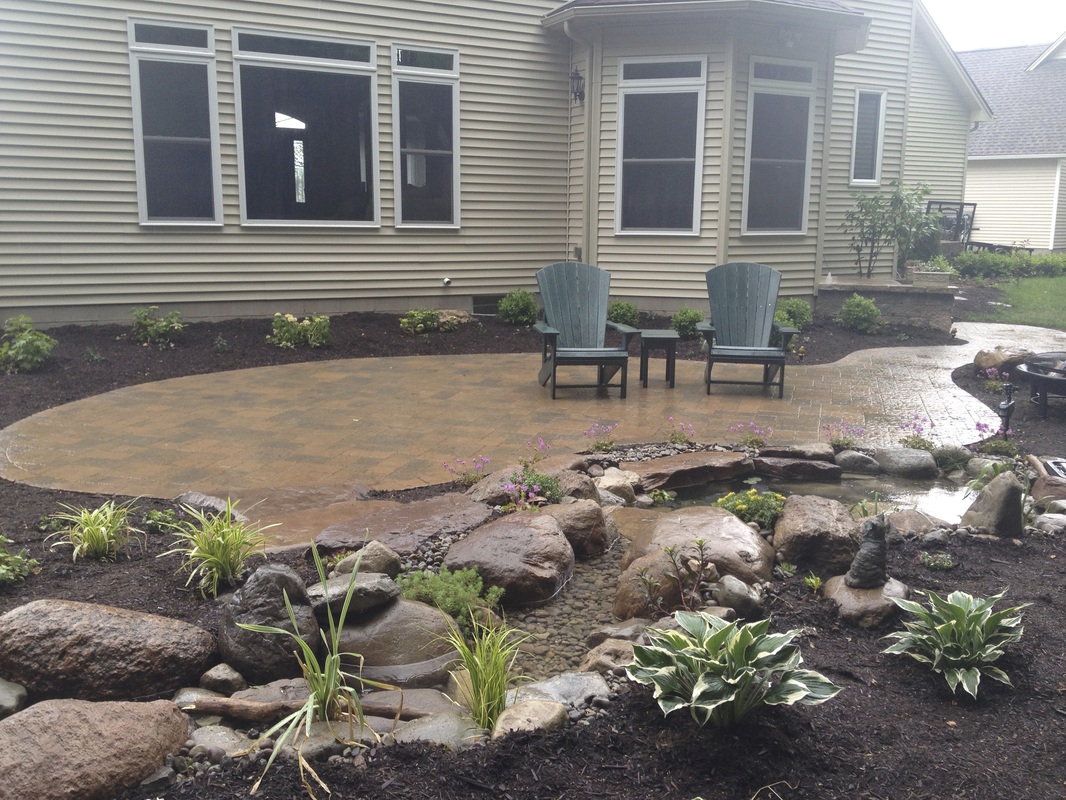Landscape design with LED Lighting, backyard fish pond & paver patio installation, outdoor living & landscaping ideas in Rochester, Greece, Pittsford, Webster, Fairport, (NY) By Acorn Ponds & Waterfalls. Image