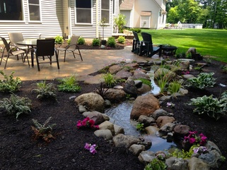 Natural looking stream & waterfall installations In Rochester New York (NY) - Acorn Ponds & Waterfalls.