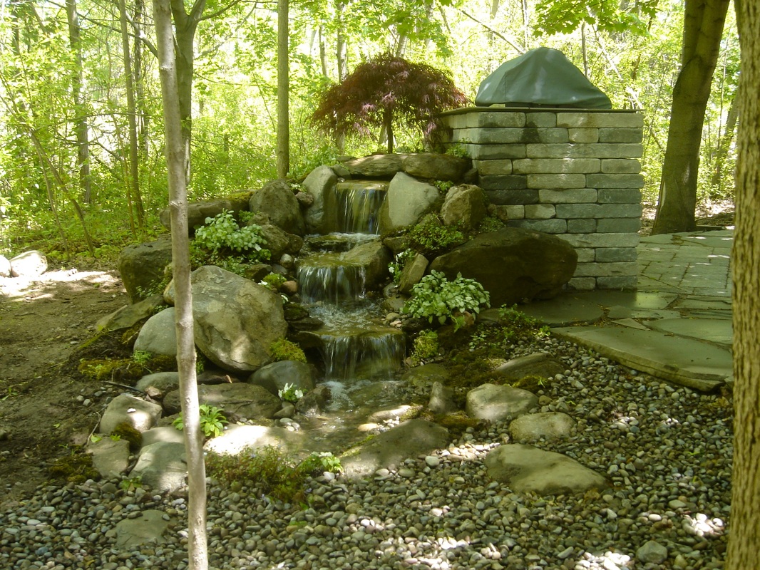 Display Pondless Waterfall Water Feature in Rochester, NY by Acorn Ponds & Waterfalls. Image