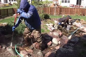 POND CLEANING, repair & maintenance in Rochester, Pittsford, Penfield, Brighton, Henrietta, Greece, Fairport, & Irondequoit (NY) by Acorn Ponds & Waterfalls. Image
